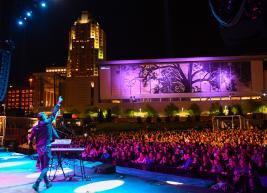 Live performers on stage at Red Hat Amphitheater at night