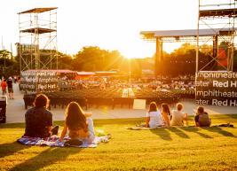 Fans enjoying the sunset from the lawn