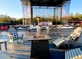 a photo of a fire pit with chairs around it at red hat amphitheater