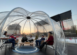 A photo of a round sphere igloo outside