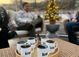 A photo of mugs on a coffee table