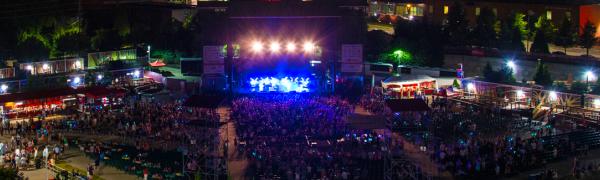 An elevated view of the crowd at Red Hat Amphitheater during a nighttime concert